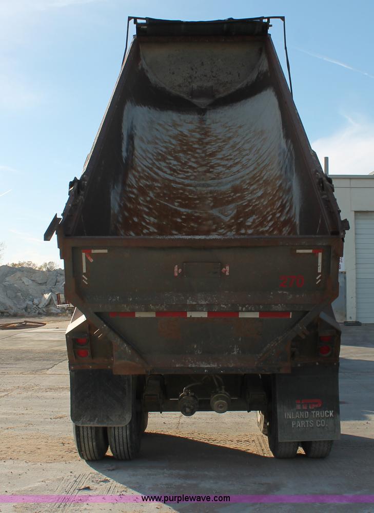 image for item H8418 1998 Travis barrel end dump trailer