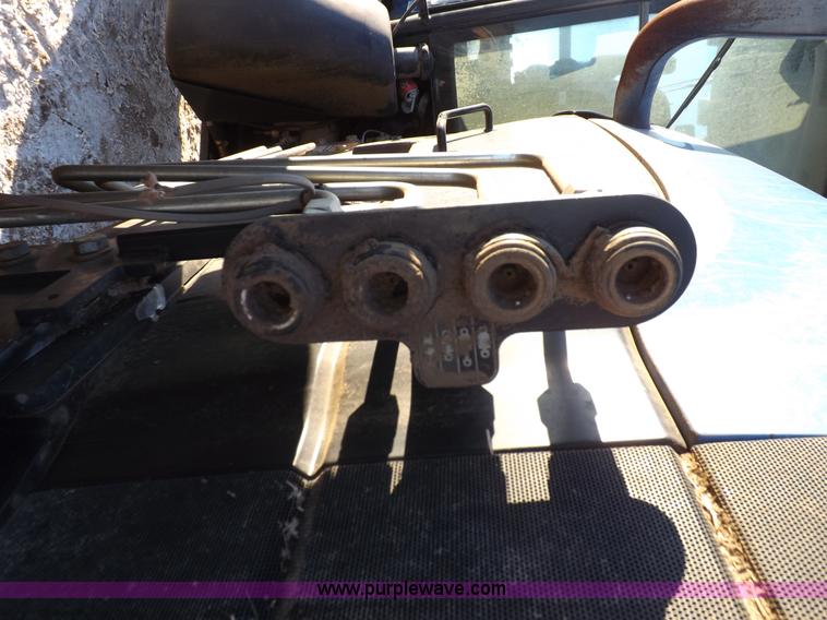 image for item I9240 2005 New Holland TV145 MFWD bi-directional tractor