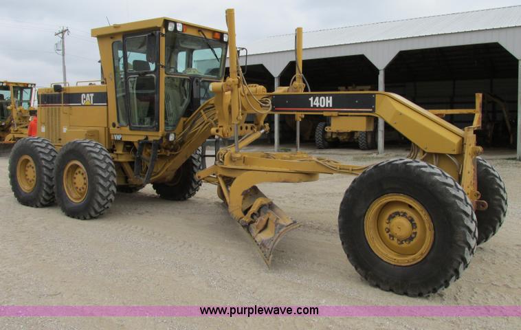 image for item F5472 1999 Caterpillar 140H articulated motor grader