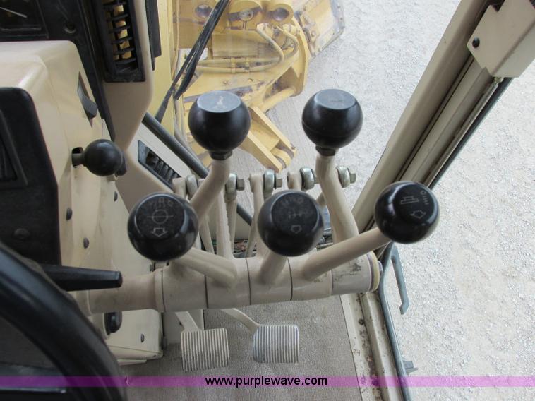 image for item F5472 1999 Caterpillar 140H articulated motor grader