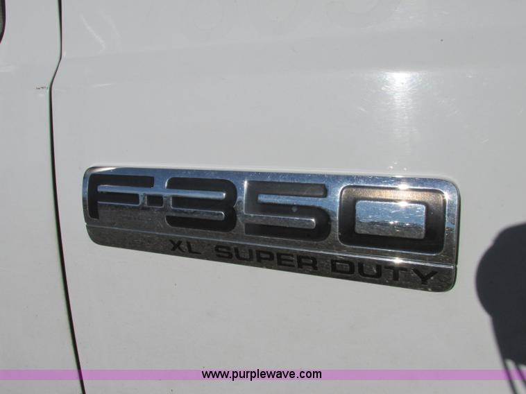 image for item F5480 2006 Ford F350 Super Duty XL SuperCab flatbed pickup truck
