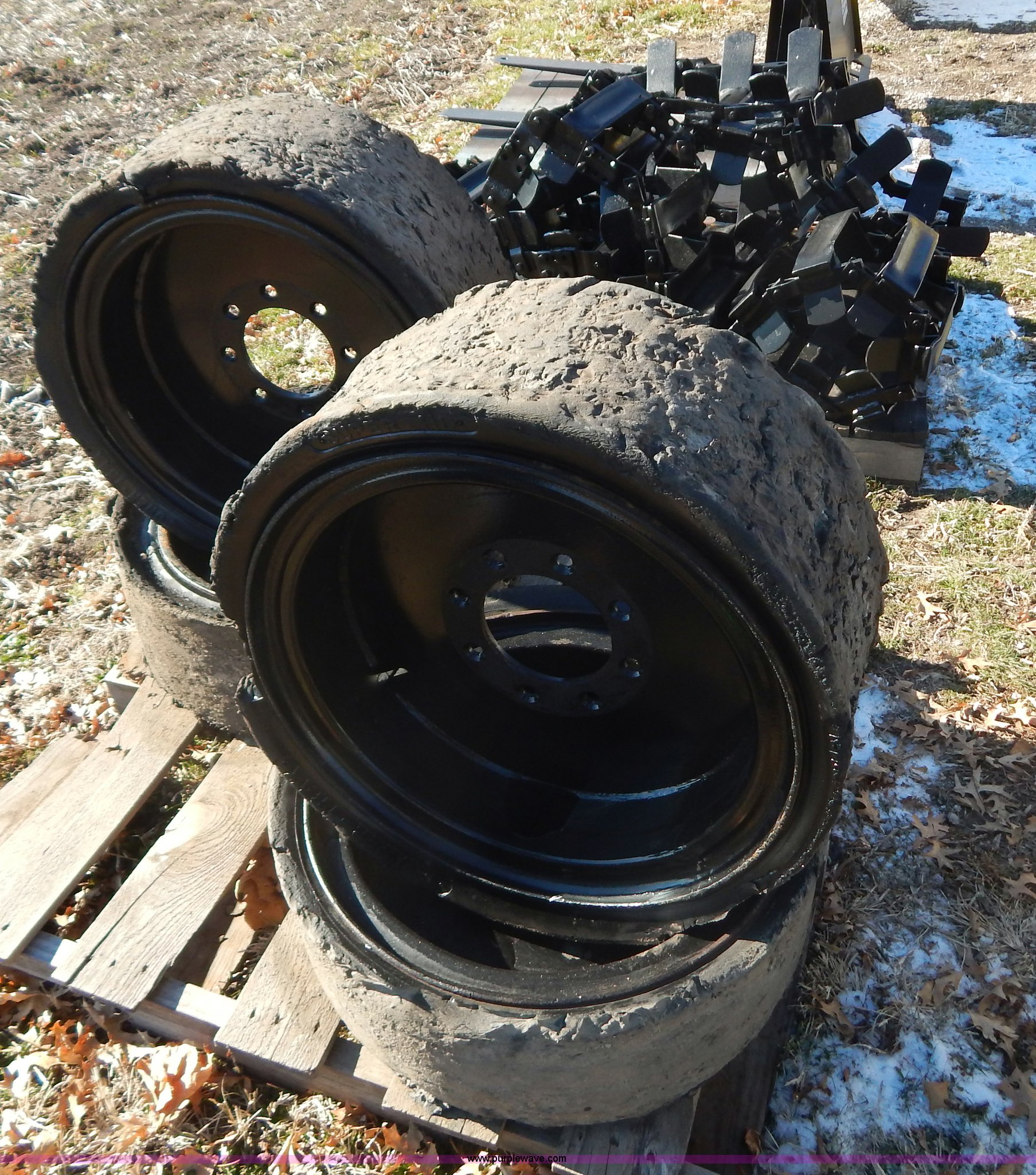 (4) 10 x 27 solid rubber skid steer tires in Hardin, MO Item H3900