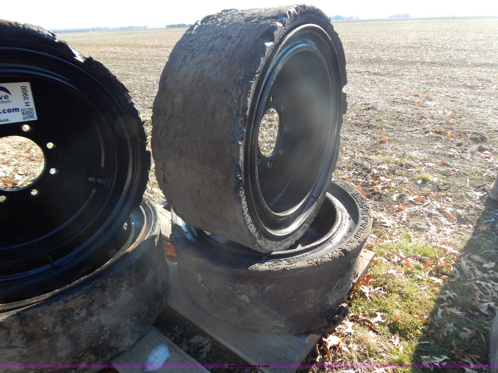 (4) 10 x 27 solid rubber skid steer tires in Hardin, MO Item H3900
