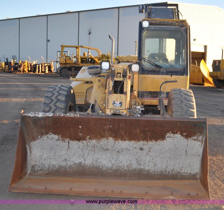 image for item G6347 1999 Caterpillar TH82 telehandler