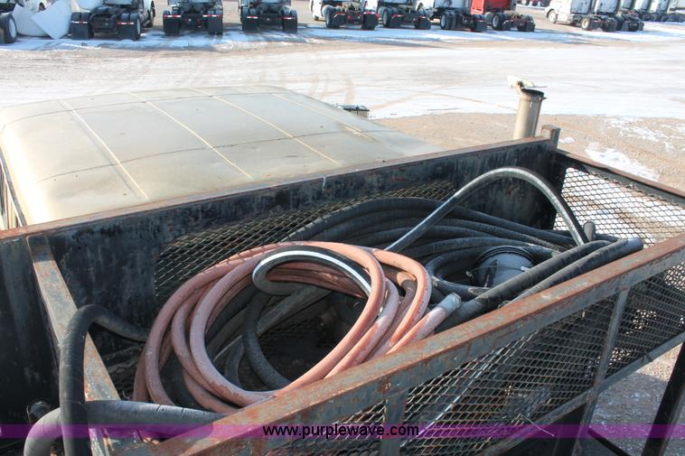 image for item H8368 2001 International 4700 Crew Cab flatbed truck