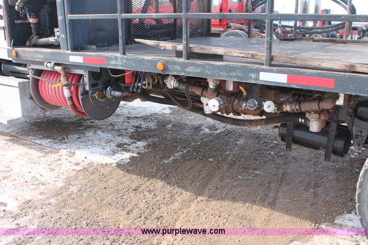 image for item H8371 2006 Peterbilt 335 flatbed truck