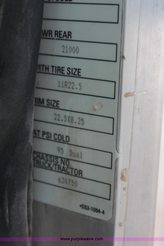 image for item H8371 2006 Peterbilt 335 flatbed truck