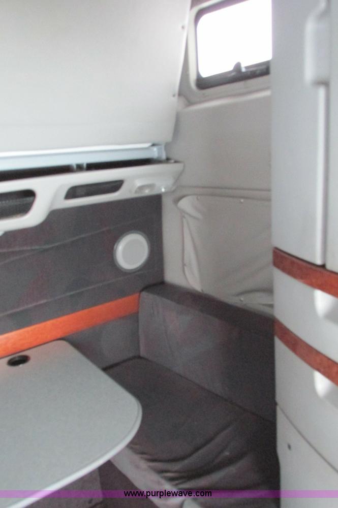 image for item E5240 2004 Volvo VNL 64T semi truck