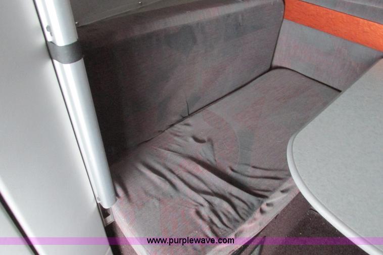 image for item E5240 2004 Volvo VNL 64T semi truck