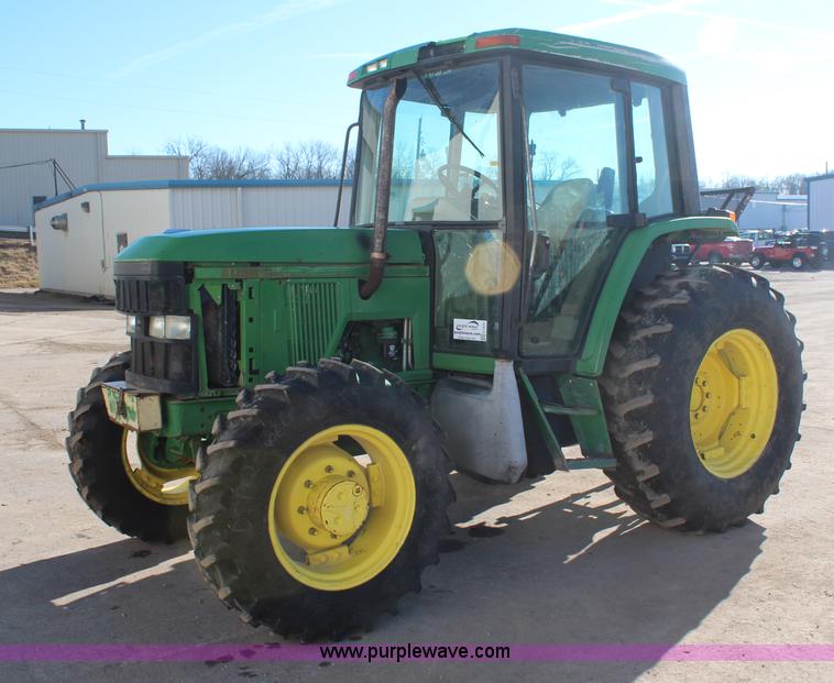 image for item H7815 2000 John Deere 6410 MFWD tractor