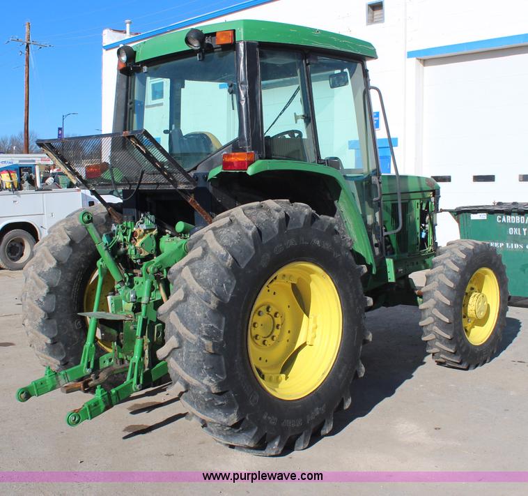 image for item H7815 2000 John Deere 6410 MFWD tractor