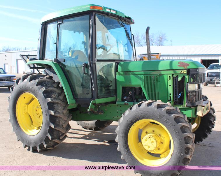 image for item H7815 2000 John Deere 6410 MFWD tractor