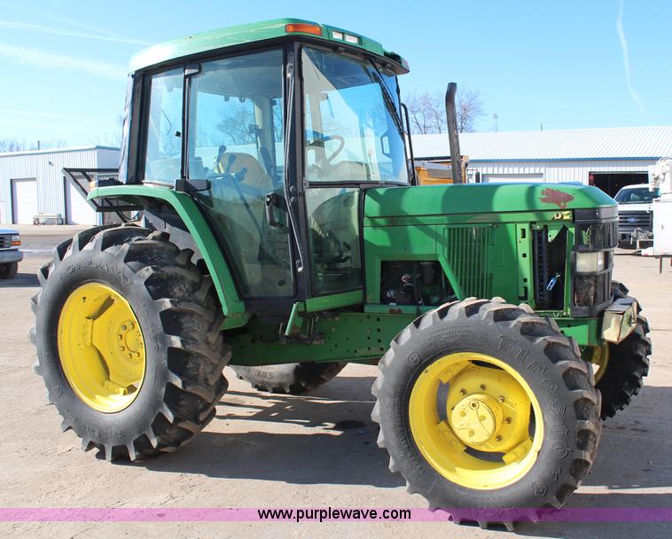 image for item H7815 2000 John Deere 6410 MFWD tractor