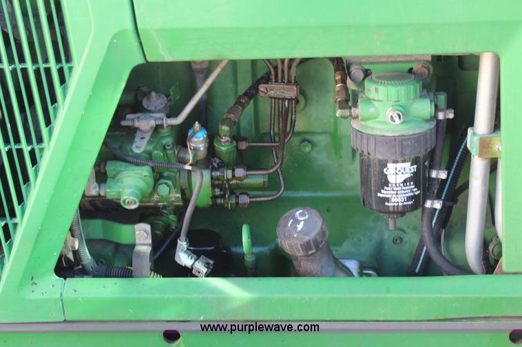 image for item H7815 2000 John Deere 6410 MFWD tractor