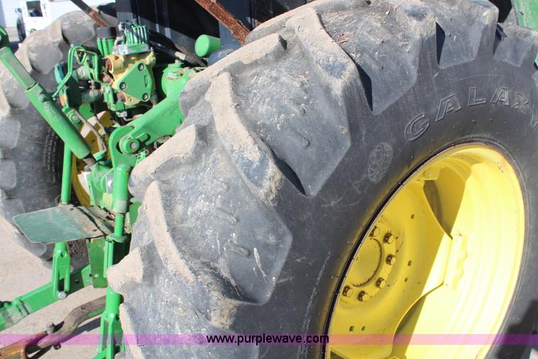image for item H7815 2000 John Deere 6410 MFWD tractor