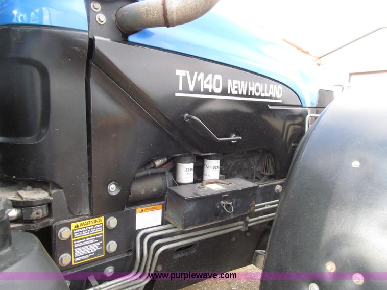 image for item E4647 2002 New Holland TV-140 bi-directional MFWD  tractor