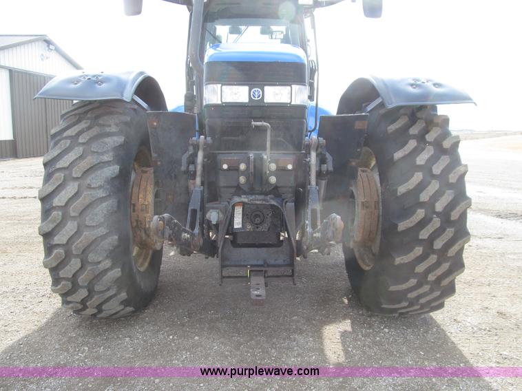 image for item E4647 2002 New Holland TV-140 bi-directional MFWD  tractor