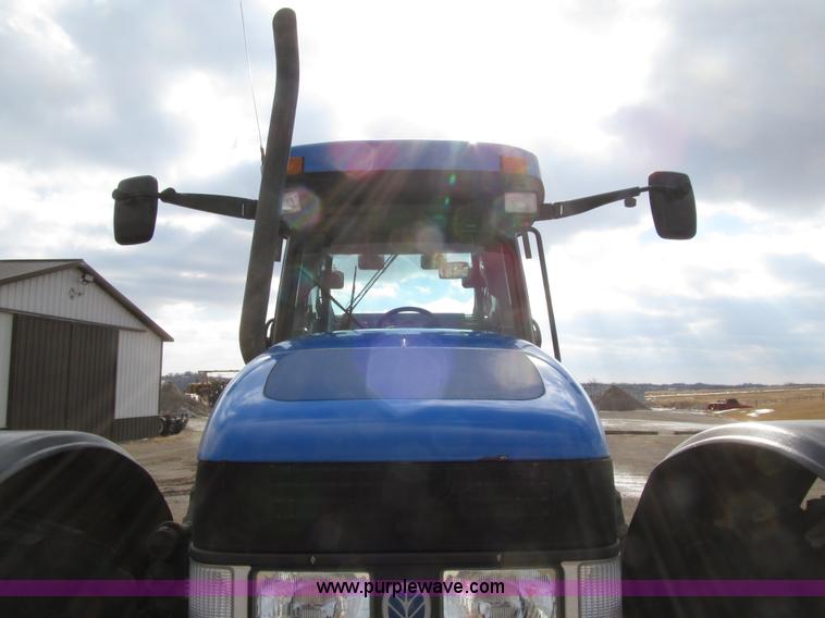 image for item E4647 2002 New Holland TV-140 bi-directional MFWD  tractor