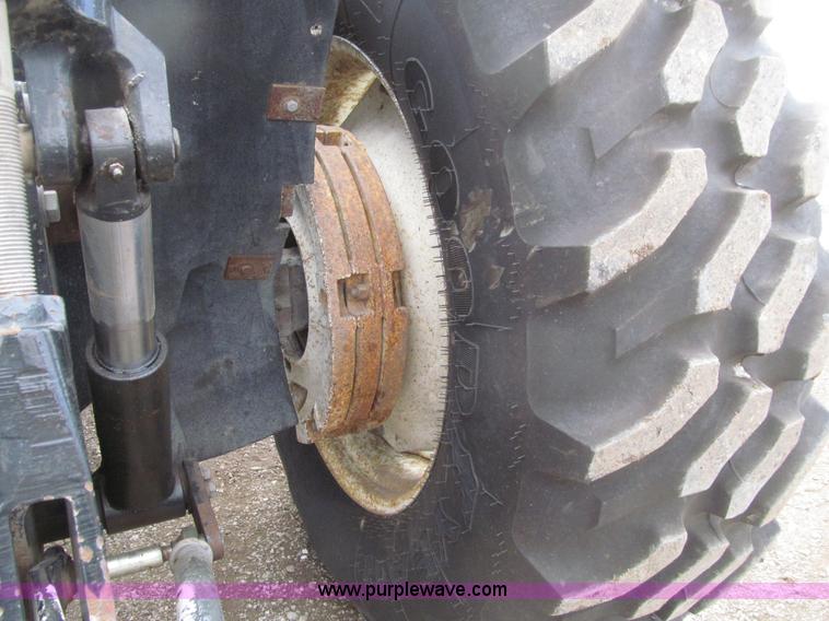 image for item E4647 2002 New Holland TV-140 bi-directional MFWD  tractor