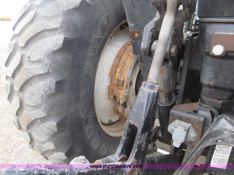 image for item E4647 2002 New Holland TV-140 bi-directional MFWD  tractor