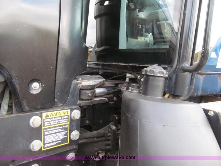 image for item E4647 2002 New Holland TV-140 bi-directional MFWD  tractor