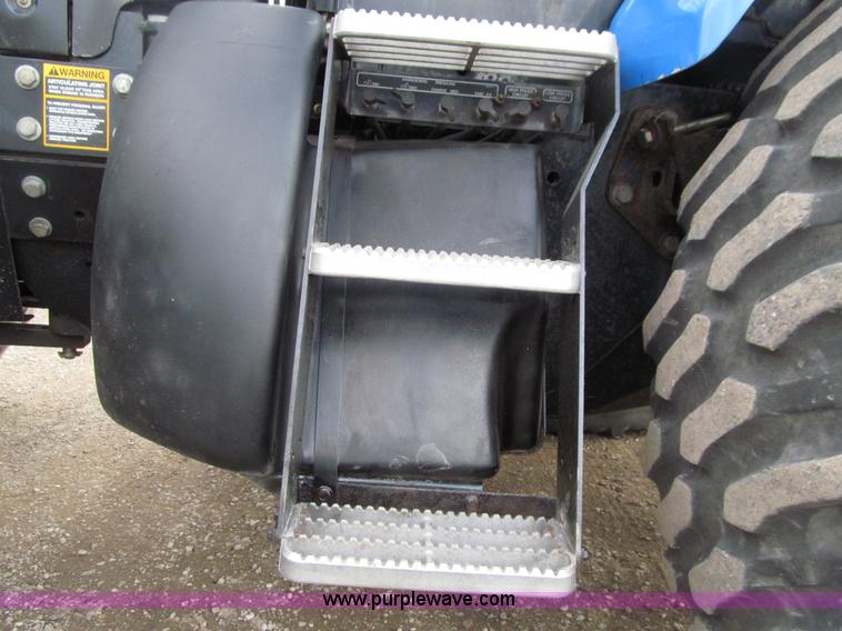 image for item E4647 2002 New Holland TV-140 bi-directional MFWD  tractor