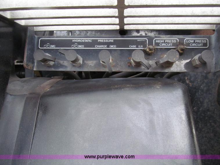 image for item E4647 2002 New Holland TV-140 bi-directional MFWD  tractor