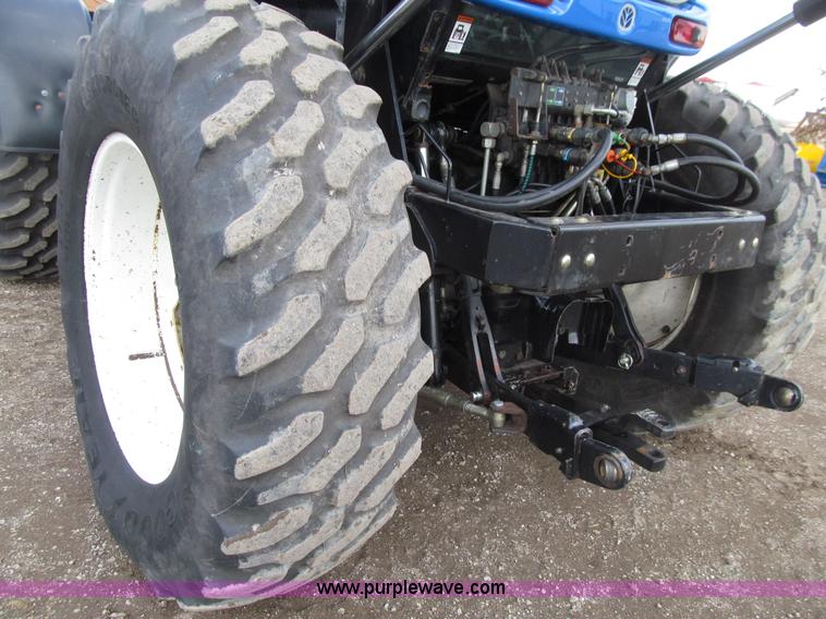 image for item E4647 2002 New Holland TV-140 bi-directional MFWD  tractor