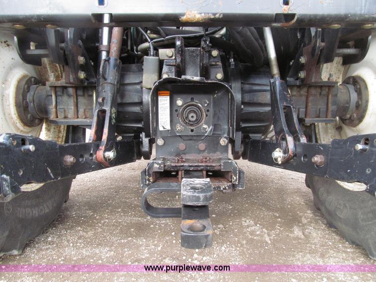 image for item E4647 2002 New Holland TV-140 bi-directional MFWD  tractor