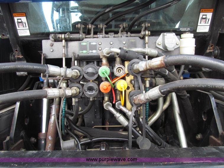 image for item E4647 2002 New Holland TV-140 bi-directional MFWD  tractor