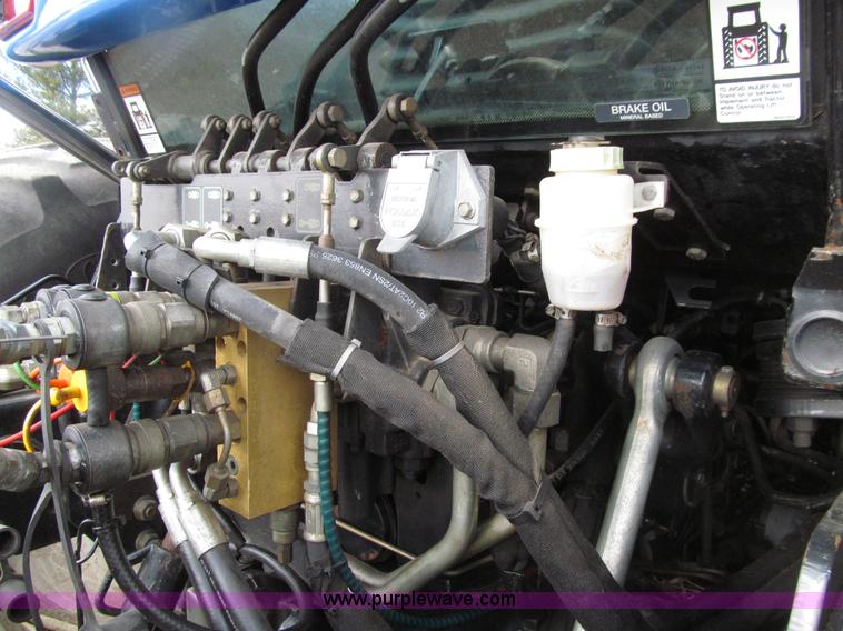 image for item E4647 2002 New Holland TV-140 bi-directional MFWD  tractor