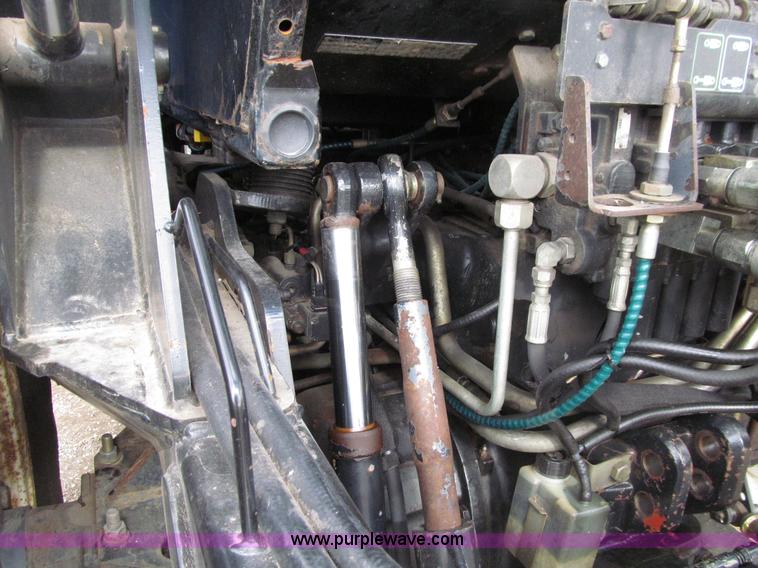 image for item E4647 2002 New Holland TV-140 bi-directional MFWD  tractor