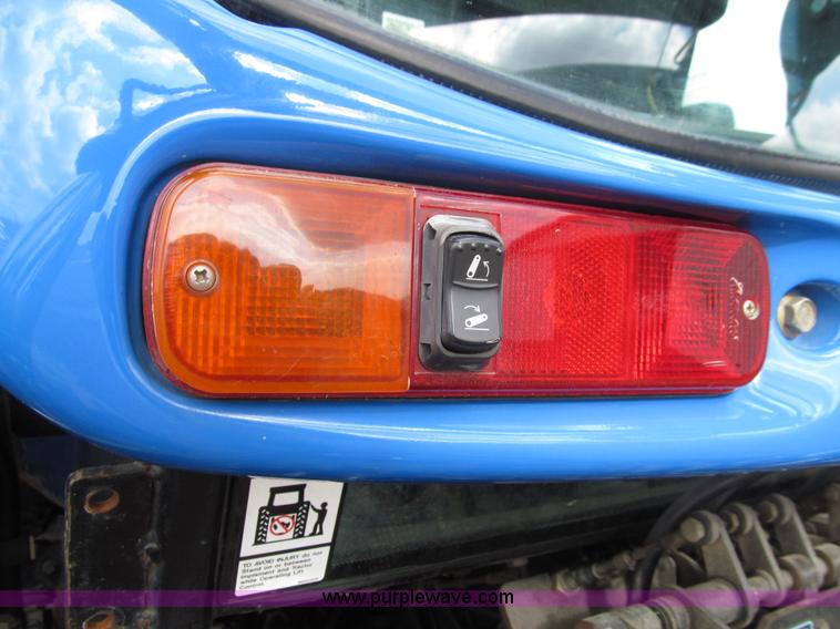 image for item E4647 2002 New Holland TV-140 bi-directional MFWD  tractor