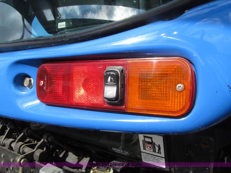 image for item E4647 2002 New Holland TV-140 bi-directional MFWD  tractor