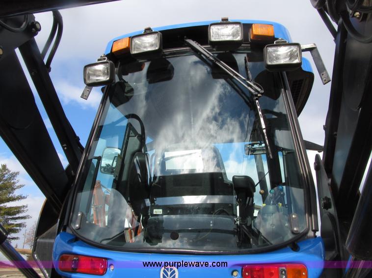 image for item E4647 2002 New Holland TV-140 bi-directional MFWD  tractor