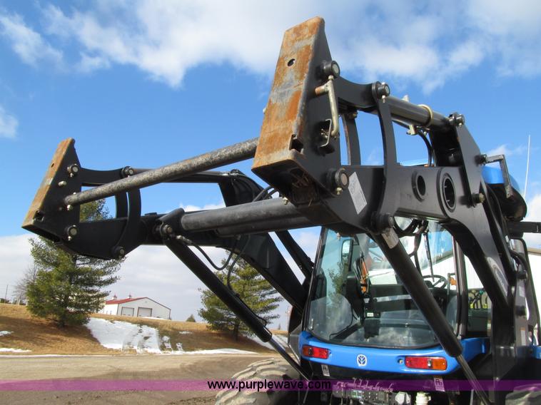 image for item E4647 2002 New Holland TV-140 bi-directional MFWD  tractor