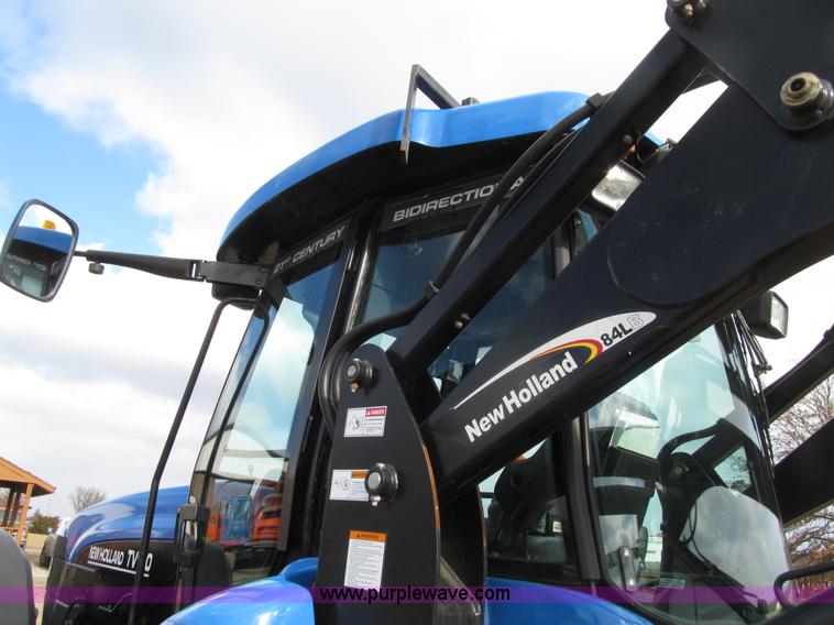 image for item E4647 2002 New Holland TV-140 bi-directional MFWD  tractor