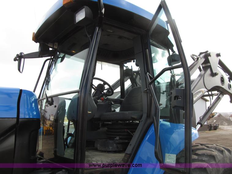 image for item E4647 2002 New Holland TV-140 bi-directional MFWD  tractor