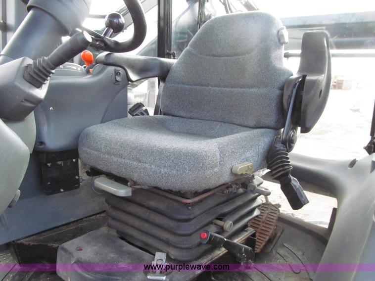 image for item E4647 2002 New Holland TV-140 bi-directional MFWD  tractor