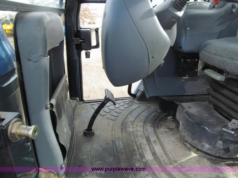 image for item E4647 2002 New Holland TV-140 bi-directional MFWD  tractor