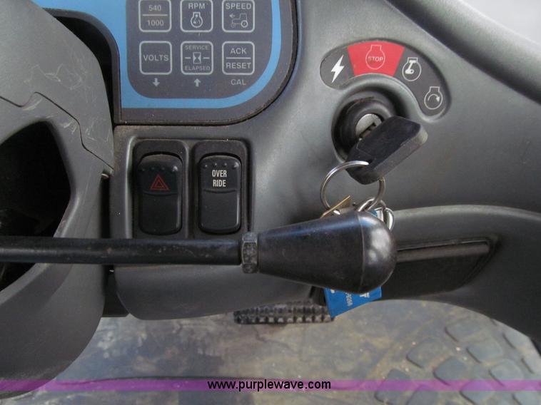 image for item E4647 2002 New Holland TV-140 bi-directional MFWD  tractor