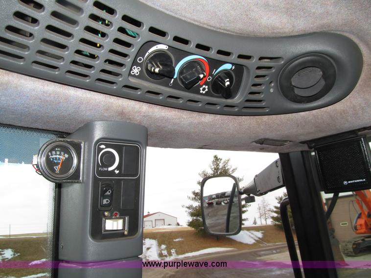 image for item E4647 2002 New Holland TV-140 bi-directional MFWD  tractor