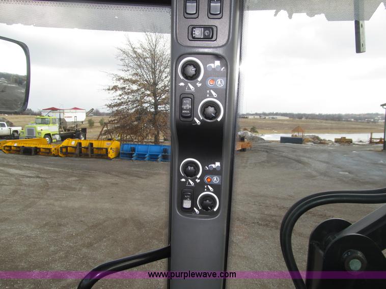 image for item E4647 2002 New Holland TV-140 bi-directional MFWD  tractor