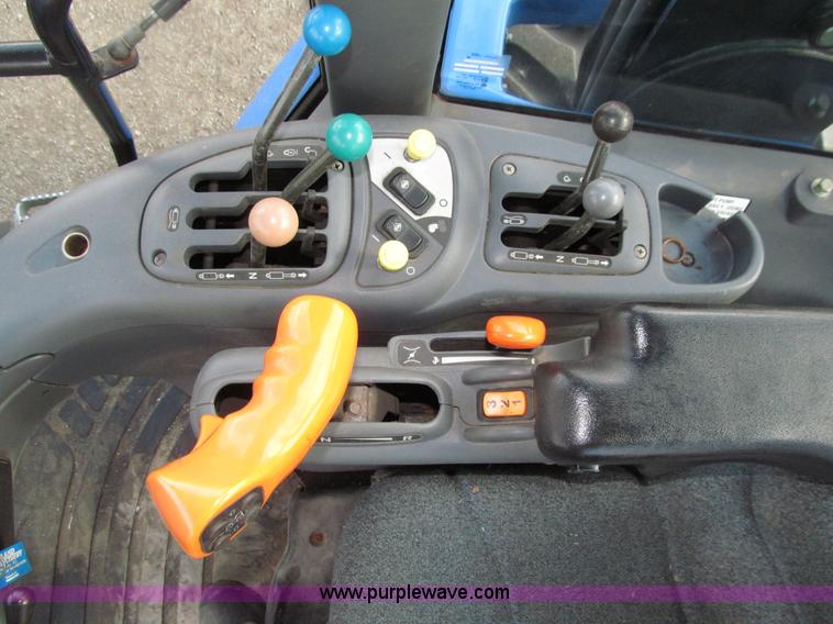 image for item E4647 2002 New Holland TV-140 bi-directional MFWD  tractor