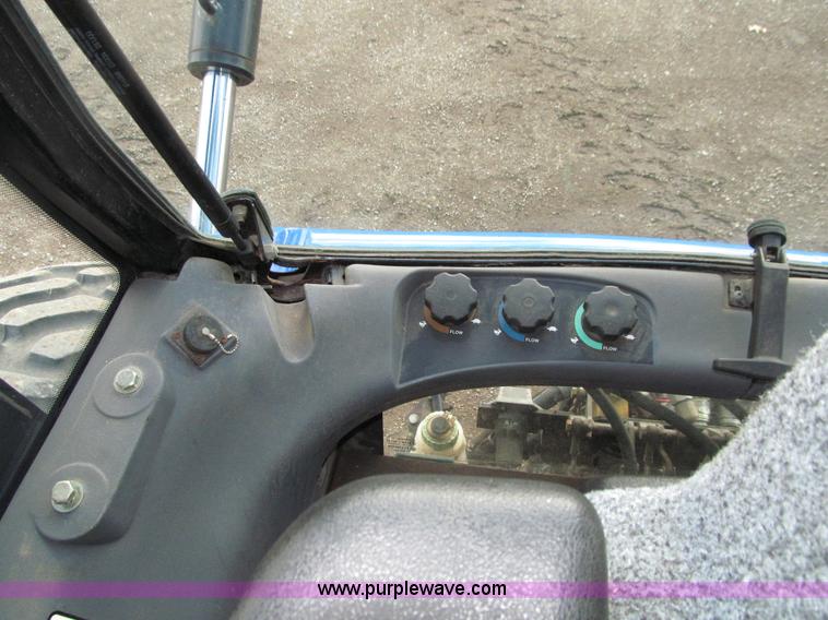 image for item E4647 2002 New Holland TV-140 bi-directional MFWD  tractor