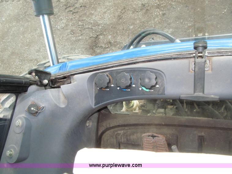 image for item E4647 2002 New Holland TV-140 bi-directional MFWD  tractor