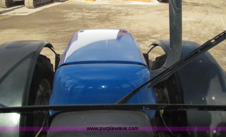 image for item E4647 2002 New Holland TV-140 bi-directional MFWD  tractor