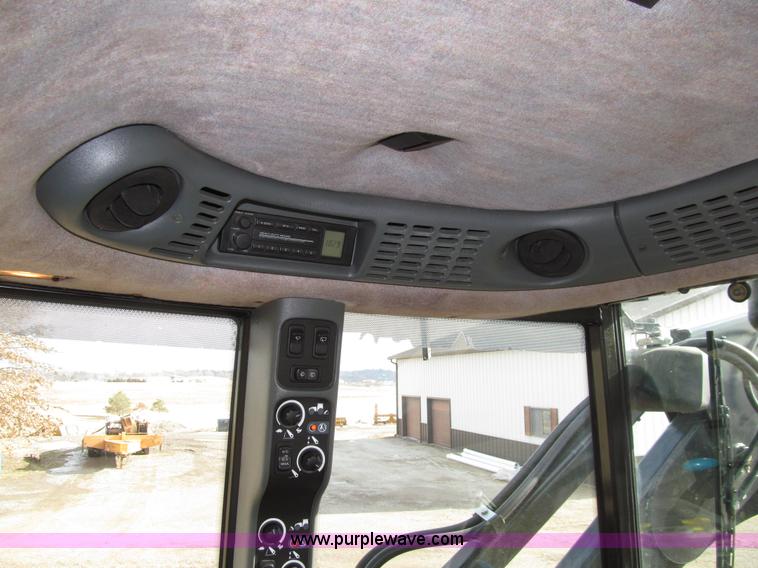 image for item E4647 2002 New Holland TV-140 bi-directional MFWD  tractor