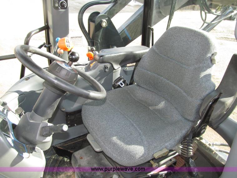 image for item E4647 2002 New Holland TV-140 bi-directional MFWD  tractor