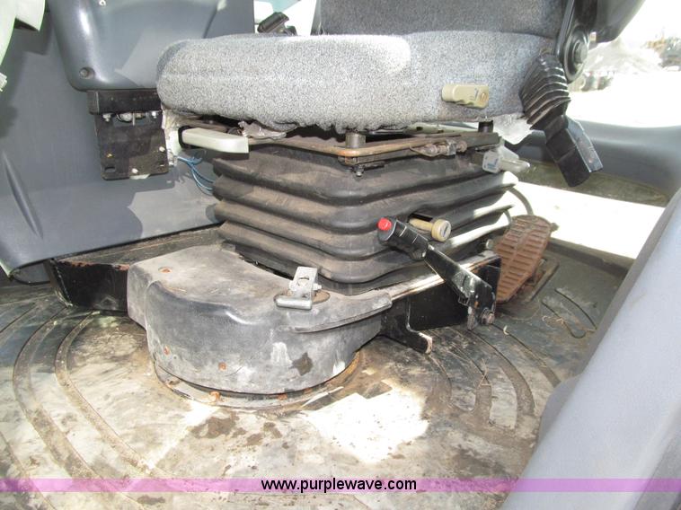 image for item E4647 2002 New Holland TV-140 bi-directional MFWD  tractor